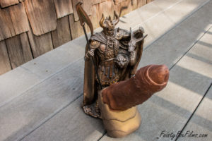Exotic Erotic's Wraith dildo, coming out of the crotch of a statue of Loki