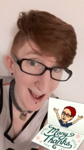 Taylor grins animatedly at the camera. In the bottom corner there's a picture of an envelope with a cartoon version of them on it and the words "Many Thanks!"