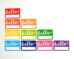a rainbow array of stickers saying "Hello my name is"